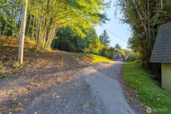 Easement Road.  Property begins on the left close to the electrical pole.  House to the right is 1377 Beach Dr.