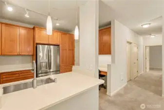 Kitchen has granite countertops, gas oven with cooktop and stainless-steel appliances