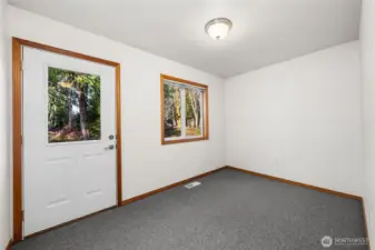 Main Floor Flex Room with exterior entrance.