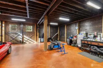 Barn features stained concrete floors on the main level.