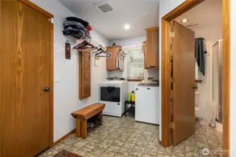 Large laundry room and 3/4 bath off the garage/shop.