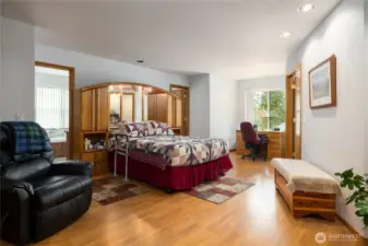 Primary bedroom is large and has two doors into the primary bathroom