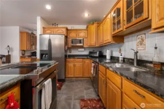 Slate flooring is easy to care for.  This is a dream kitchen.
