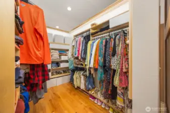 The large walk-in closet’s ample storage is tucked behind a barn door, and offers great lighting to help you choose the perfect ‘fit for your day.