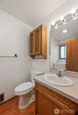 This is the main floor half bath and laundry room with privacy window.