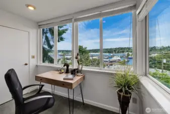 Work from home with a view! This bright corner office overlooks the Canal, with a direct line toward South Lake Union—bringing inspiration, light, and serenity to your daily grind.