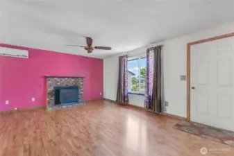 Living Room w/laminate flooring & cozy wood stove