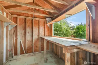 Workbench in garden shed w/window opening for all your projects