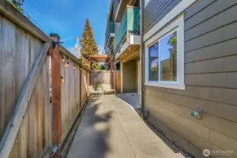 The patio extends along the full length of fencing. You can have fun designing how you want to use this space.