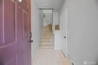 Large entry with door to right to access the garage. Notice the cute ledge to display your treasures!
