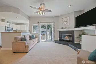 Look how inviting this living space is. Wood burning fireplace with a large storage area next to it comes in super handy. Open space to fit a big television. Updated fan helps keep things cool in the summer.