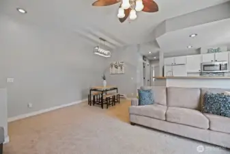 Dining area off the living space and kitchen with updated chandelier.