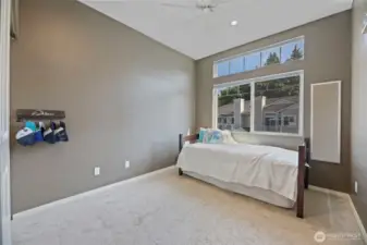 Good sized first bedroom with spacious windows. Don't worry, those windows have blinds on them to block out the light when you sleep.