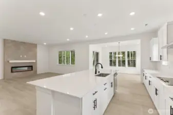 ***Actual Home *** Kitchen, Great room and the Sunroom make this space airy and bright with access to the covered patio looking out to the green space.