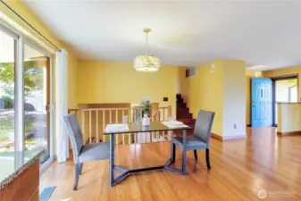 DIning area just off of the kitchen with back patio access.