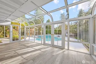 Indoor comfort meets outdoor beauty in this stunning sunroom