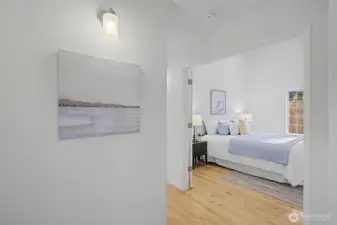 Double-door entry into the primary bedroom with a bright, inviting feel.