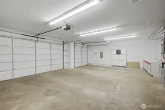 Oversized attached garage offering excellent space for vehicles, storage, and projects.
