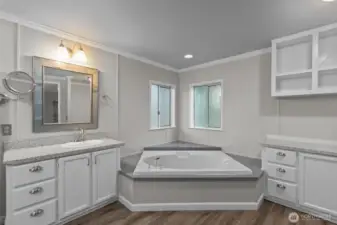 Primary Bath is a 5-Piece with soaking tub.  All the cabinetry has been painted and there is new crown molding.