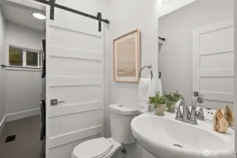 On the main floor:  Half bath for guests and laundry hidden behind with custom cabinetry.