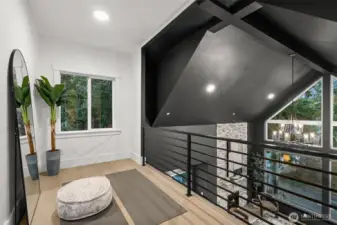 Perched above it all, the loft showcases stunning views and endless possibilities—library, meditation space, or inspired workspace.
