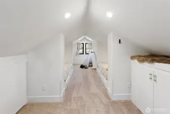 Upstairs is delightful with built-in storage, two queen-sized built-in beds, and a bonus area with views to the Sound and the Olympic mountains. The carpet is brand nes, as is the lighting, sheetrock, electrical, and more.