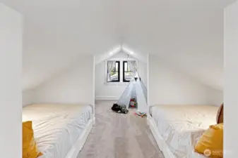 Two built-in beds with drawers underneath for storage are a great use of space in the upper level.  Each has its own charging station. There is also a custom closet system for hanging and storing clothes.