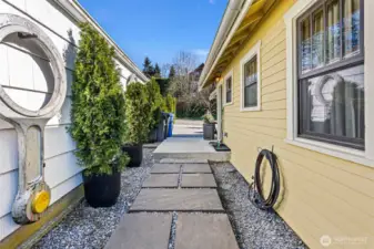 The side yard has also been refurbished and spruced up. The Dutch door into the kitchen can be accessed from here.