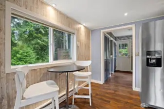 Looking across the dining area toward the laundry room and back door.
