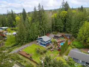 Looking down from above you can see how private this home is and all of the outbuildings and the pool.