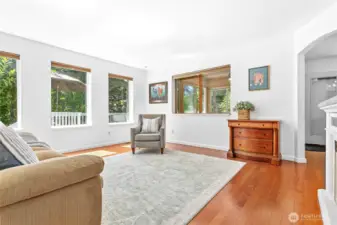 The large living area is warm and inviting, with lots of natural light!