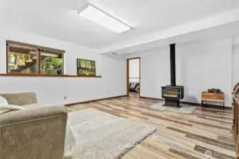 Downstairs bonus room, with a view to the 3rd bedroom downstairs