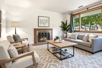 Living room with hardwoods & fireplace (Virtually Staged)