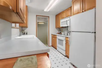 Kitchen leads to family room area.