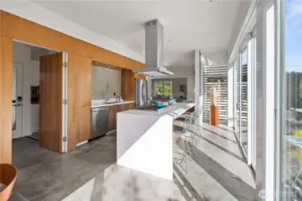 Behind the great room area is the butler's pantry & a powder room
