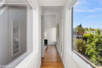 Let's head up stairs to the ideal layout...This hallway also has Downtown Seattle views