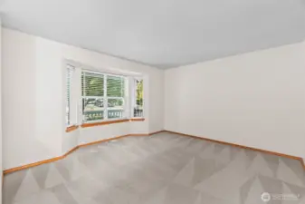 This is the front living room overlooking the front porch. Could be living space, office, or TV room. Lots of options.