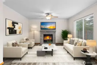 The family/great room (vitually staged). Lots of space and a large picture window brings in plenty of light.