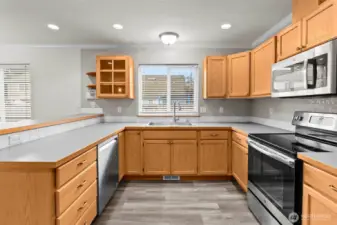 Roomy kitchen overlooks the dining area and family/great room.