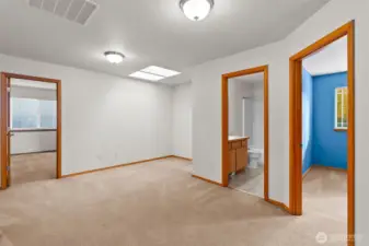 The upstairs loft, surrounded by 4 bedrooms and a full bathroom.