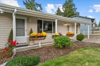Flowers still blooming front and back on this large homesite.