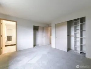 Primary bedroom, looking into ensuite bath and closets.  So much storage!