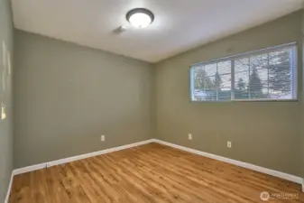 Main Floor Primary Bedroom with Laminate Floors.