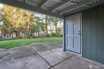 Downstairs Patio with a Large Storage Unit to the Right.