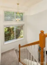 Sunlit staircase with lovely, filtered light.  The balance between privacy and natural light is truly perfect