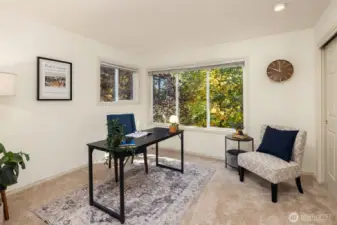 Corner windows bring light to the bedroom from two different directions