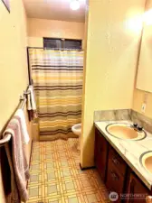 Bath serving the three additional bedrooms on main level.