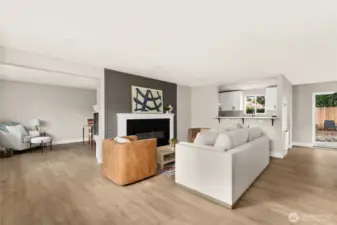 Open floor plan with wide-plank luxury floors, cozy FP with living and dining spaces perfect for entertaining.