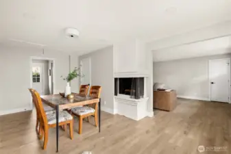 Light, bright dining/flex space with cozy wood burning firplace
