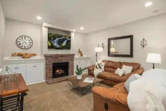 The family room is open to the kitchen and breakffast nook - cozy fireplace